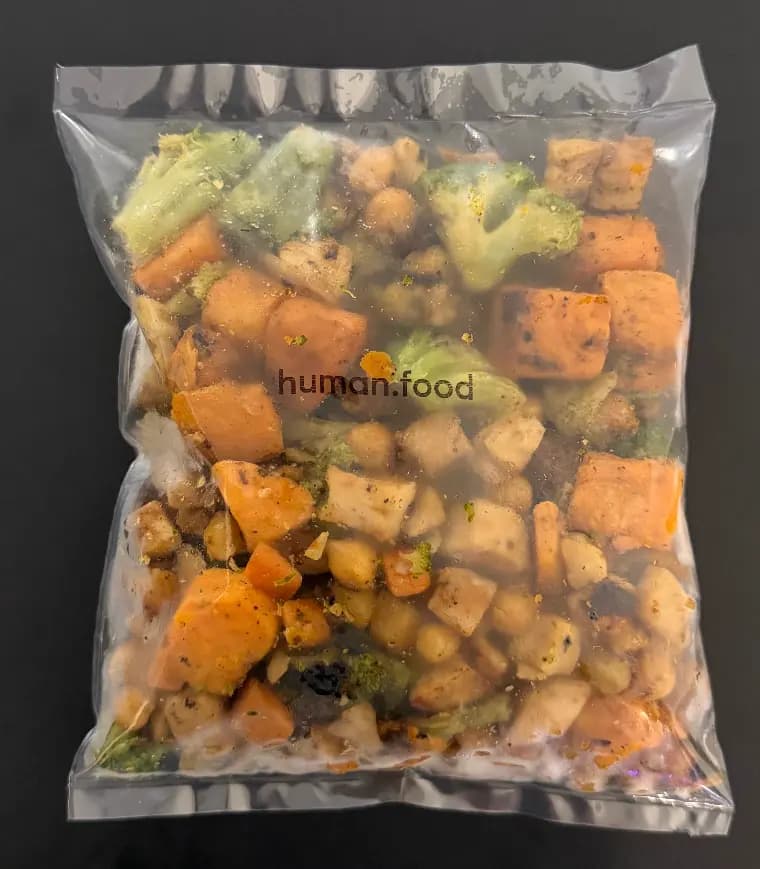 A packaged Human Food meal with vegetables, chickpeas, and tofu